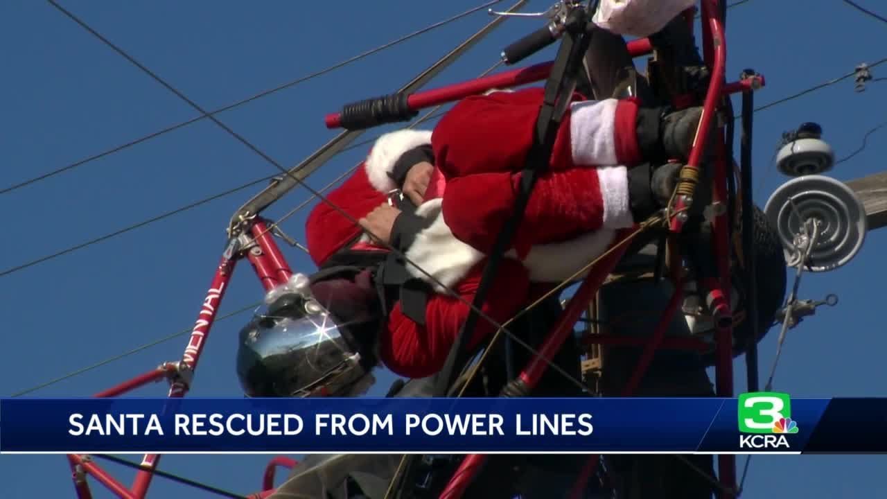 Man on powered parachute dressed as Santa rescued from power lines